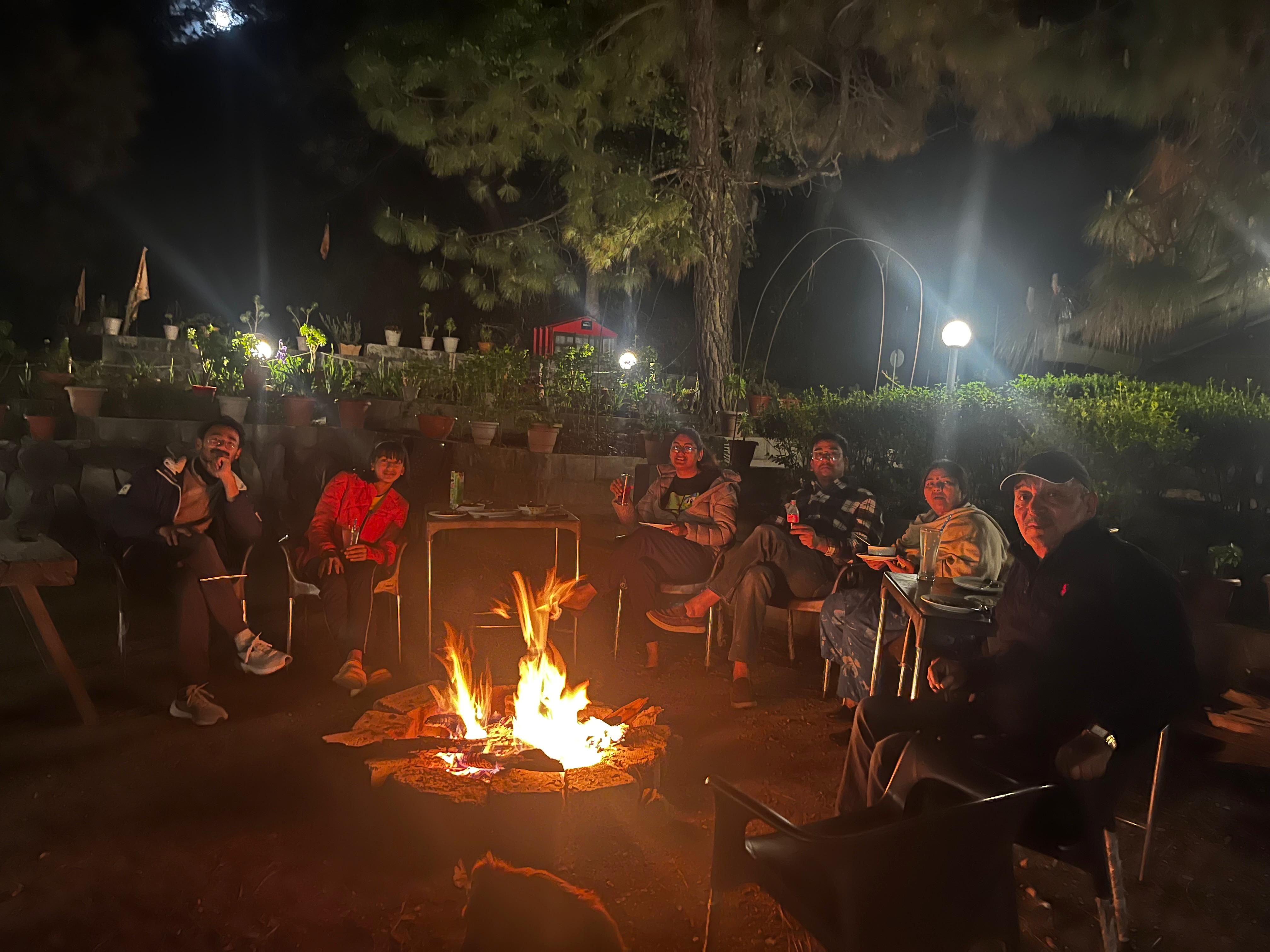 Evening bonfire with guests at The Glide Inn, Junga